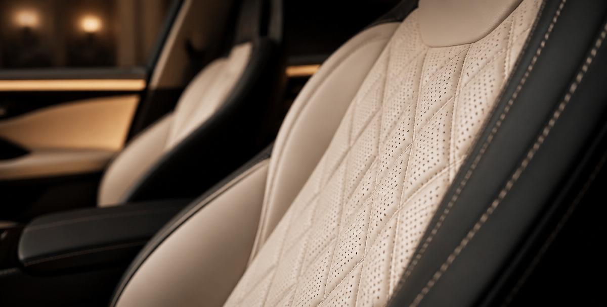 Close-up of diamond-stitched luxury leather car interior